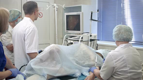 Medical Team Performing Surgery Using Endoscope