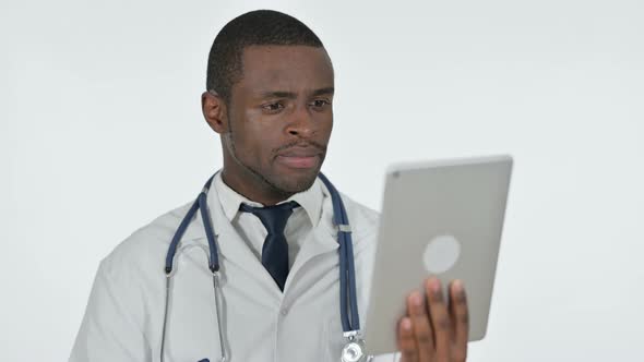 Video Chat on Tablet By African Doctor, White Background