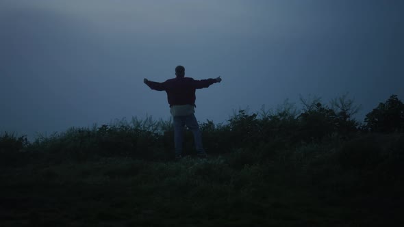 Lonely Guy Walking in Misty Field