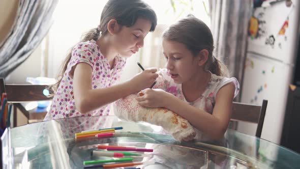 Children Paint Their Hand in a Bandage