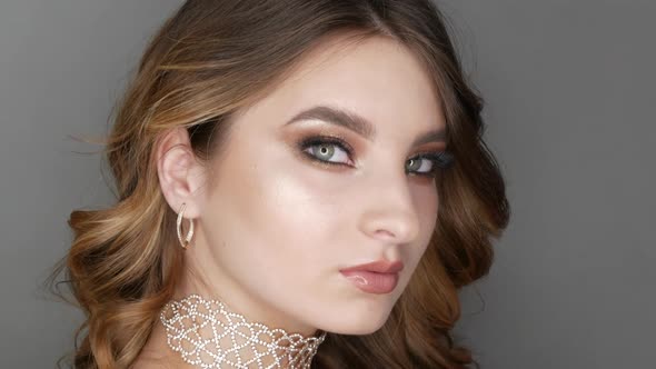 Portrait of Beautiful Young Girl Model in Stylish Evening Make Up Smoky Eyes Posing