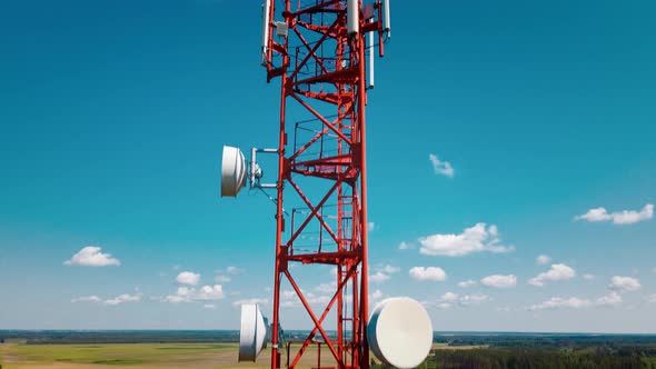 Aerial View of 4G and 5G Cell Tower with Antennas and Satellites