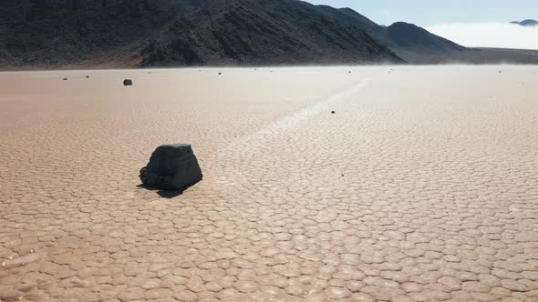 Famous Race Track Playa with Moving Rocks By the Dry Cracked Surface of Desert
