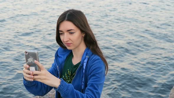 Girl Makes Selfie On The Background Of The Sea 3