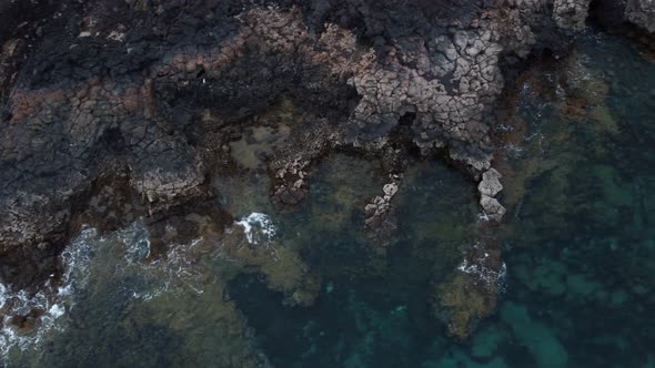 Top down aerial view of the rocky and mountainous coast in Lanzarote, Canary Islands