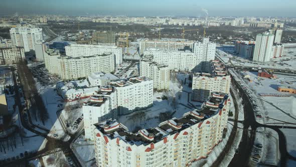 City quarters. Multi-story houses. Winter cityscape.