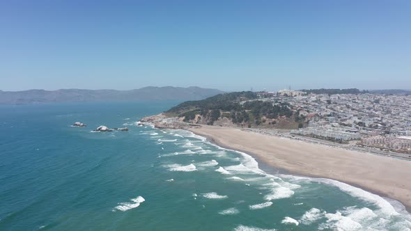 Super wide aerial shot of Land's End from Ocean Beach in San Francisco. 4K