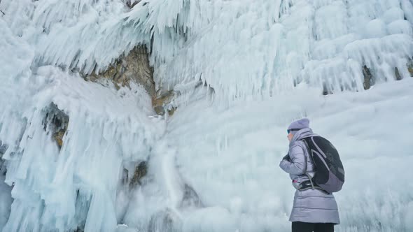 Travel of Woman on Ice of Lake Baikal