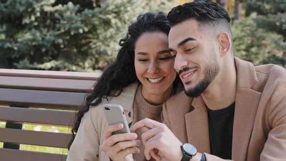 Young Hispanic Married Couple Discussing Online Order Happy Man Woman Smiling Browsing Websites