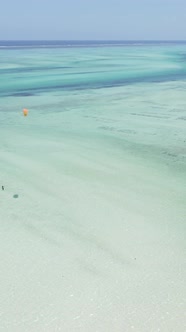 Vertical Video Kitesurfing Near the Shore of Zanzibar Tanzania