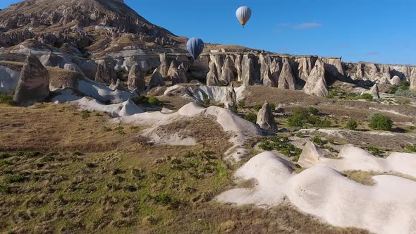 Aerial Hot Air Balloons Flying Over Hoodoos and Fairy Chimneys in Ihlara Valley Aksaray, Turkey