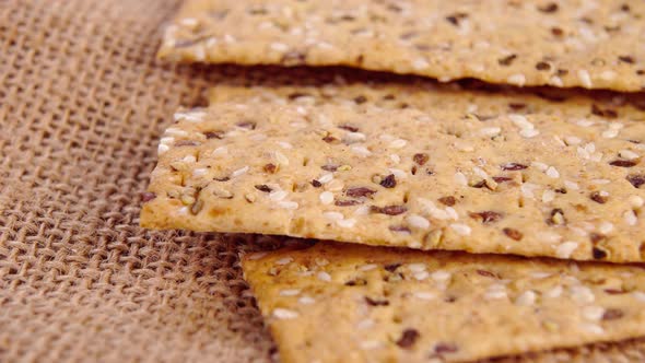 Crunchy crispbreads with sesame and flax seeds. Healthy dietary meal. Macro