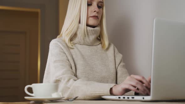 Woman Freelancer Working on Laptop at Homeoffice