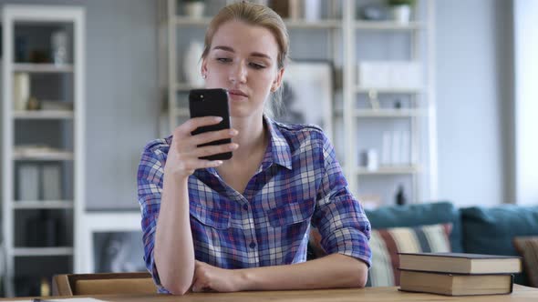 Young Woman Busy Using Smartphone