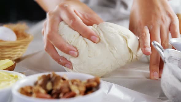 Woman preparing dough for pastry
