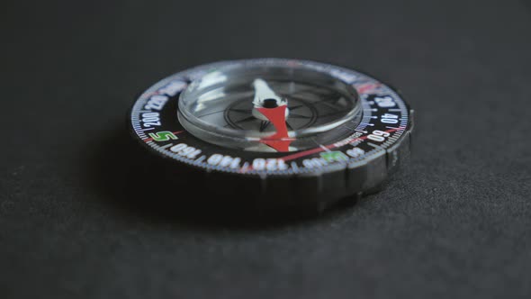 Extreme Close Up of a Transparent Modern Compas on Black Background