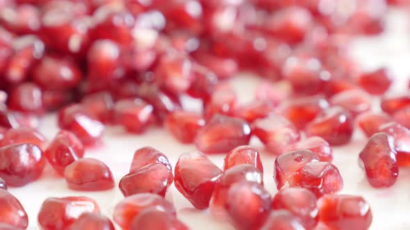 Red seeds of Lythraceae family juicy pomegranateshallow DOF  4K 3840X2160 UHD tilting video -Pile of