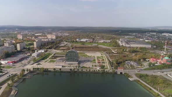 Aerial view of Modern building in the city in the form of a washer 03