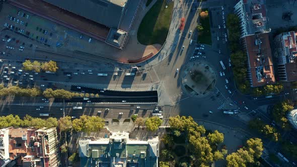 Aerial Birds Eye Overhead Top Down Ascending Shot of Traffic on Roundabout and Surrounding Multilane