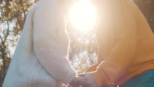 Happy Old Couple Holding Hands in Park. Senior Man Flirting with Elderly Woman. Romance at Old Age