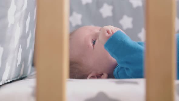 Mother Takes Bottle From Baby Beginning To Scream in Bed