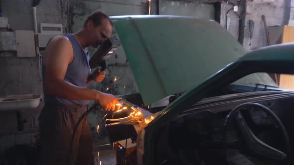 Professional Repairer Wearing Protective Mask Welding Auto Details