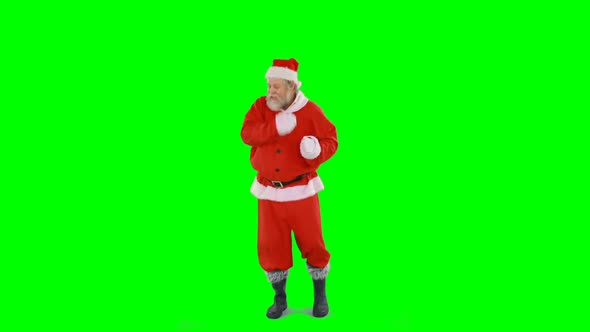 Santa claus dancing against green background