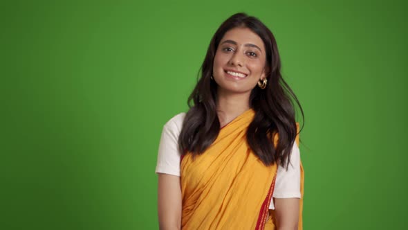 Smiling traditional Indian woman looking at the camera