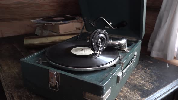 Old Phonograph Gramophone Patephone Retro Interior with Rotating Vinyl Record LP