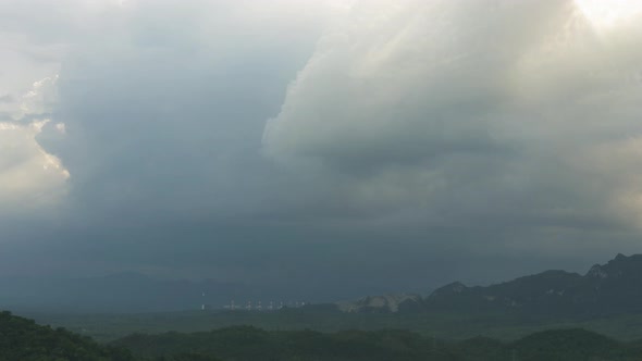 Rain storms and black clouds moving over the mountains.