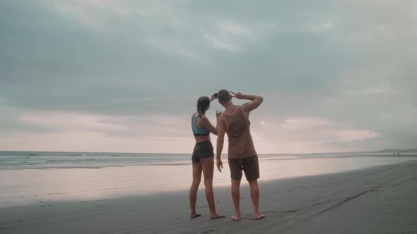 Sporty Couple Video Calling on Seaside