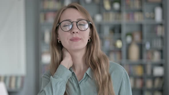 Portrait of Tired Woman Having Neck Pain in Office