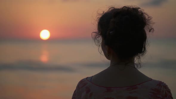 Woman Watching Sea Sunset. Gimbal Shot. FHD, 