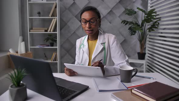 Woman Doctor Consulting Patient Via Internet