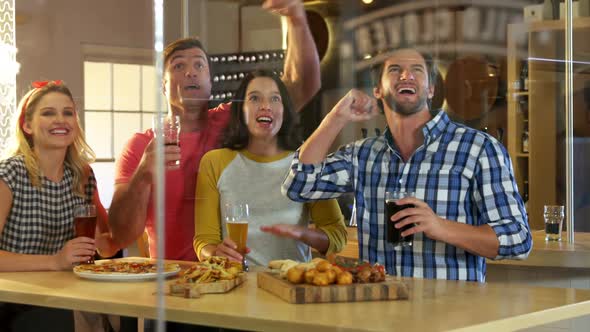 Friends toasting glass of beer at brewery factory 4k