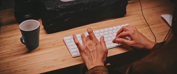 A woman typing on the keyboard