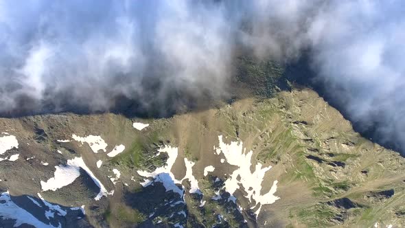 Dry and Damp Air Masses on Two Different Slopes of the Mountain Ridge