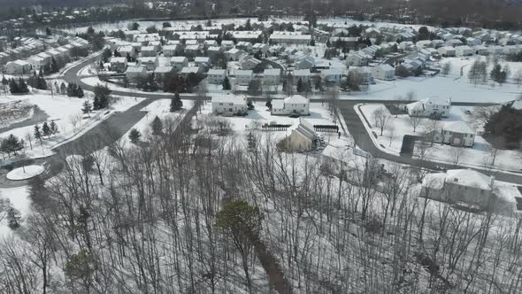 Beautiful Snow Covered City Street with Houses with a Apartment Buildings in USA