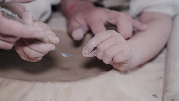 Craftsman Hands Connect the Clay Parts Made of Raw Clay