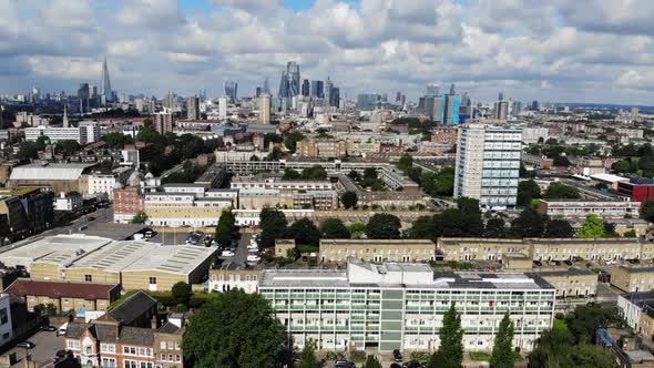 Aerial view of council estates in East London with London skyline in the background