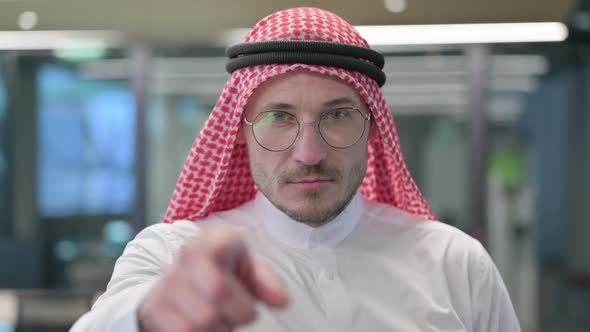 Middle Aged Arab Man Pointing at the Camera