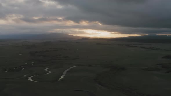 A View From a Drone of a Beautiful Sunset in the Valleys with the River