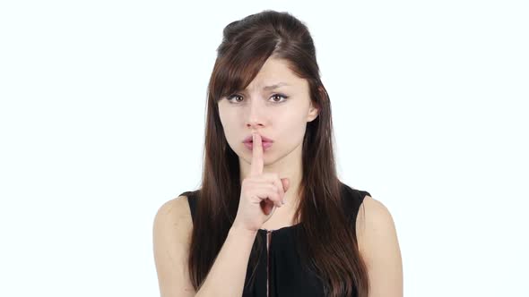 Gesture of Silence by Young Girl, Finger on Lips