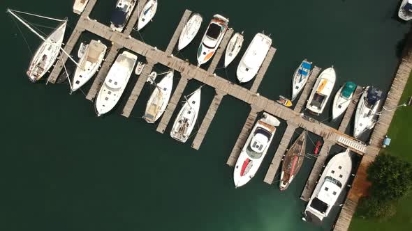 Aerial shot over a marina filled with sailboats.