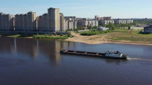 A Barge Is Floating on the River