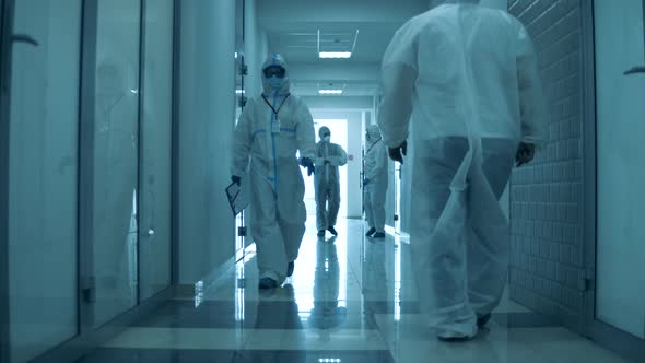 People Wear Protective Suit While Working in Hospital During Pandemic.