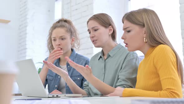 Disappointed Female Startup Team Reacting To Failure on Laptop