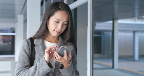 Business woman using smart phone at outdoor