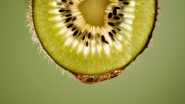 Juicy Kiwi Slice on Green Background