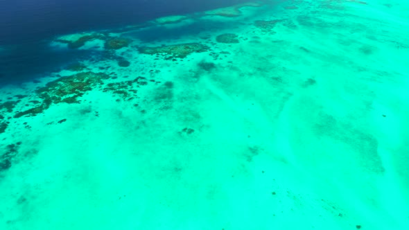 Aerial view landscape of idyllic shore beach trip by blue ocean and white sandy background of a dayo